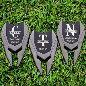Shows divot tools engraved with a large letter and name through it with title and date under it.