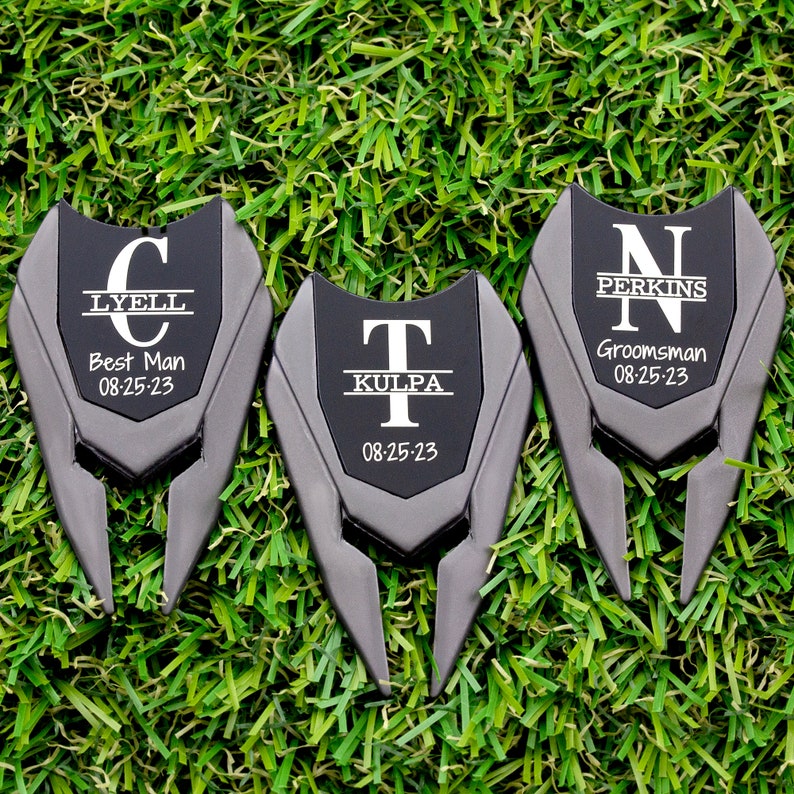Shows divot tools engraved with a large letter and name through it with title and date under it.