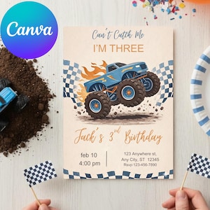 May include: A birthday invitation with a blue monster truck illustration, flames, and checkered flags. The text reads "Can't Catch Me I'm Three" and "Jack's 3rd Birthday". Includes date, time, and address details. Two small checkered flags are held in the hands.