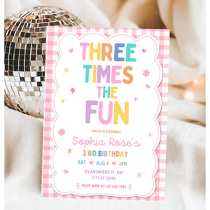 May include: A rectangular birthday invitation card with a pink and white gingham border. The text reads: THREE TIMES THE FUN, JOIN US TO CELEBRATE, Sophia Rose's 3 RD BIRTHDAY, SAT AUG 4 2PM, 123 ANYWHERE ST, ANY CITY, ST 12345, RSVP JAMIE AT 123-456-7890.