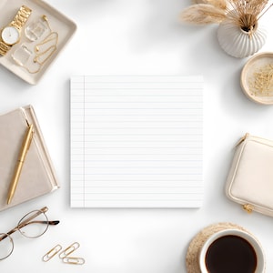 May include: An overhead shot of a white desk with a lined notepad as the central focus. Surrounding the notepad are various accessories, including a gold watch, jewelry, a pen, glasses, paper clips, a small purse, a coffee cup, and decorative items.