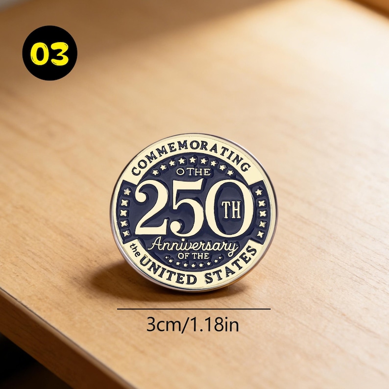 May include: A round commemorative pin, 1.18 inches in diameter, celebrating the 250th anniversary of the United States. The pin features the text "Commemorating the 250th Anniversary of the United States" in a circular design with a navy blue and gold color scheme.