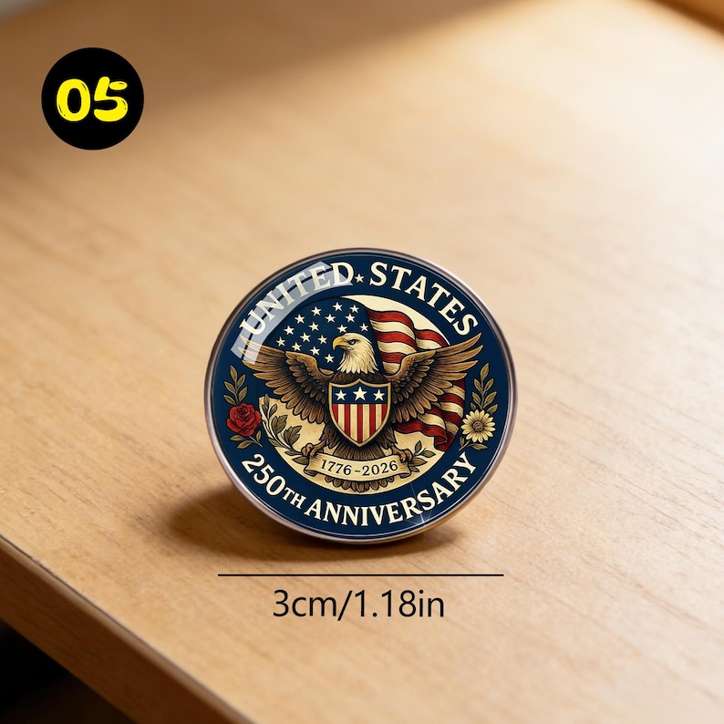 May include: A round, blue and gold commemorative pin with the text "UNITED STATES 250TH ANNIVERSARY 1776-2026". The pin features an eagle, American flag, and stars. The pin is 1.18 inches in diameter.