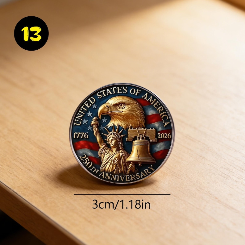 May include: A round commemorative coin with a diameter of 1.18 inches. The coin features the text "United States of America" and "250th Anniversary". The design includes an eagle, the Statue of Liberty, and the Liberty Bell, with a red, white, and blue background.