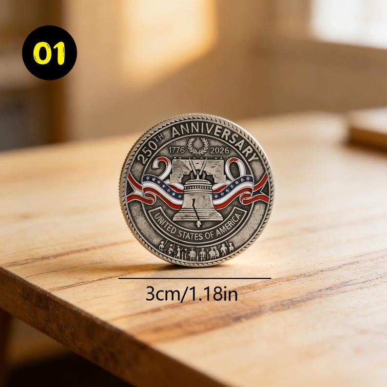 May include: A silver coin commemorating the 250th anniversary of the United States, with the years 1776 and 2026. The coin features the Liberty Bell, red, white, and blue ribbons, and the text "United States of America". The coin is 1.18 inches in diameter.