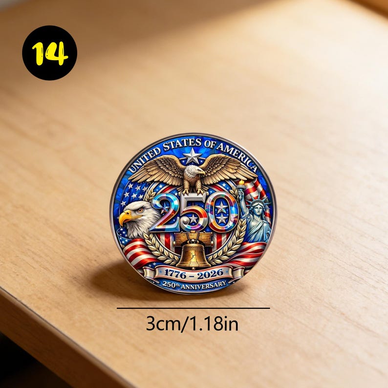 May include: A round commemorative coin with a patriotic design. The coin features an eagle, the Statue of Liberty, and the text "250" with the dates 1776-2026. The coin is 1.18 inches in diameter.