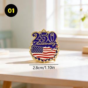 May include: A gold-colored pin with a blue and red design. The pin features the text "250 Anniversary" and an American flag design. The pin is 1.10 inches in diameter.
