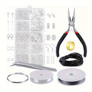 May include: A jewellery making kit containing a clear plastic organiser box filled with silver-toned findings, needle-nose pliers with black handles, a gold-toned ring, a coil of black cord, silver wire, clear elastic thread, and metal tweezers.
