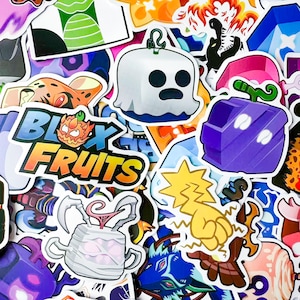 May include: A collection of colorful stickers featuring various designs and characters. The stickers include a white ghost with a blue outline, a purple fruit with white accents, and the text "Blox Fruits" in a stylized font. Other stickers feature cartoon characters and abstract shapes.