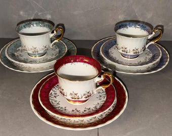Vintage Tassenset 9 tlg von Fena Tasse, Untertasse und Kuchenteller in drei Farben