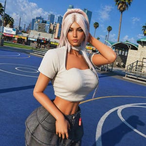 May include: A woman in a white crop top and grey denim skirt stands on a blue basketball court. The background features palm trees, buildings, and a sunny sky. The woman has long blonde hair.