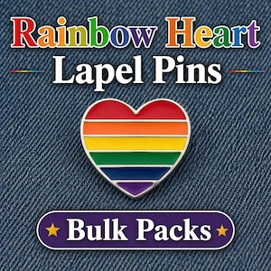 May include: A rainbow heart lapel pin with a silver border, set against a denim background. The pin features a heart shape with horizontal stripes in the colors of the rainbow. Text at the top reads "Rainbow Heart Lapel Pins".