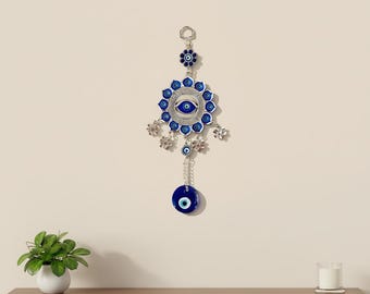 Grote wandhanger boze oog met maan- en bloemdessin | Handgemaakte amulet voor thuisbescherming