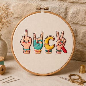 May include: A circular wooden embroidery hoop containing white fabric with hand-stitched embroidery. The design features four anthropomorphic hands forming the letters of the word DUCK, each with a smiling face, colorful bracelets, and nails.
