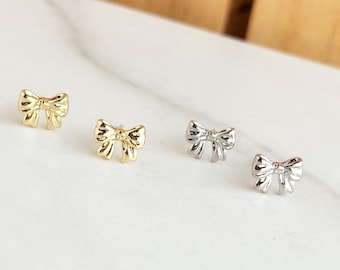 Orecchini a bottone Coquette Bow, gioielli in argento dorato