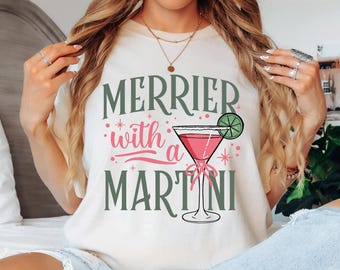 Comfort Colors® Merrier With A Martini Shirt, Funny Christmas Cocktail Tee, Girls Night Out Party Top, Holiday Martini Graphic T-Shirt Gifts