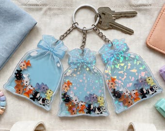 Kawaii kattfiskshakare nyckelring, flytande havskatt i en väska nyckelring för nycklar eller ryggsäck, present till kattälskare, ADHD fidget-tillbehör