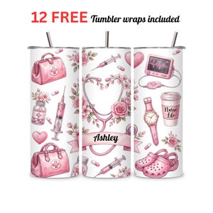 May include: A set of three stainless steel tumblers with pink medical-themed designs. The designs include a stethoscope, medical bag, watch, and the name "Ashley". The text "12 FREE Tumbler wraps included" is at the top.