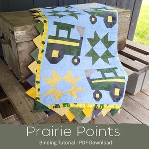 May include: A light blue quilt with green tractors, yellow stars, and green star patterns. The quilt has a yellow and green patterned border with a sawtooth edge. The text "Prairie Points" and "Binding Tutorial - PDF Download" are at the bottom.