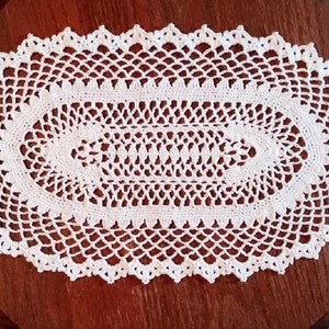 Crocheted White Oval Doily (p18)