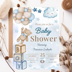 Può includere: Invito per baby shower con un design ad acquerello. Un orsacchiotto tiene in mano dei palloncini sopra le parole "Baby Shower". L'invito include la data, l'ora e le informazioni RSVP. La combinazione di colori è blu, marrone e bianco.