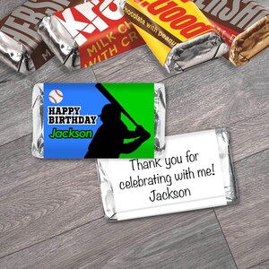 May include: Miniature candy bars with baseball-themed wrappers. One wrapper reads "Happy Birthday Jackson" with a baseball and batter silhouette. Another says "Thank you for celebrating with me! Jackson."