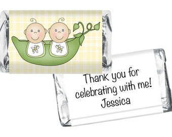 May include: Two baby characters in a green pea pod with a yellow and white checkered background. The text on the wrapper says "Thank you for celebrating with me! Jessica"