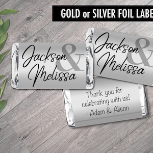 May include: Silver foil labels with the text "Jackson & Melissa" and "Thank you for celebrating with us! - Adam & Alison".