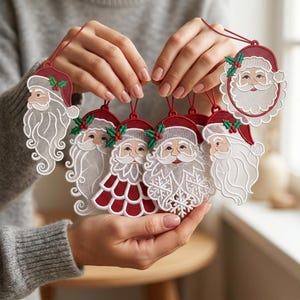 May include: A collection of six embroidered Santa Claus ornaments featuring intricate white lace beards, red hats with green holly accents, and red hanging loops. Each ornament displays a unique facial expression and detailed stitching patterns.