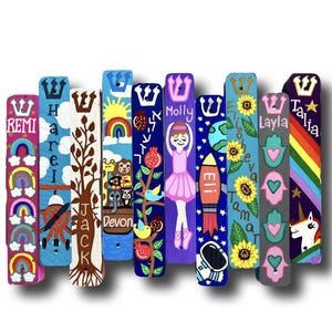 A collection of colorful and uniquely decorated bookends, each featuring a different design or character.