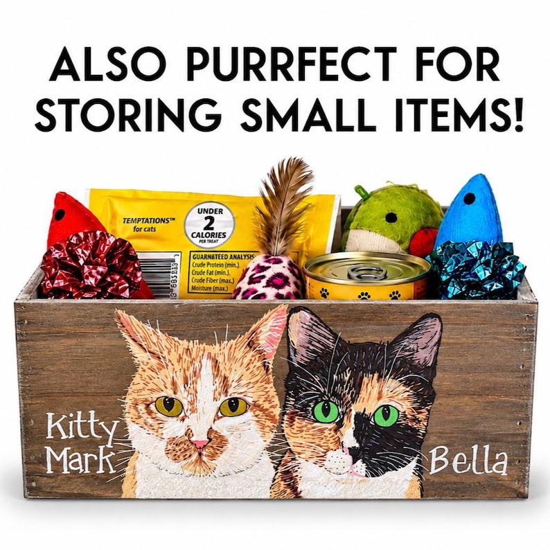 May include: Wooden storage box with a painted image of two cats, "Kitty Mark" and "Bella". The box is filled with cat toys, treats, and a can of food. Text at the top reads "ALSO PURRFECT FOR STORING SMALL ITEMS!"