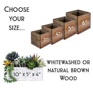 a set of three wooden planters sitting next to each other