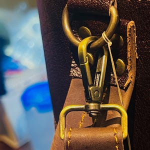 Close-up of the monogram-ready front pocket on the Personalized Vintage Cowhide Leather Golf Bag.