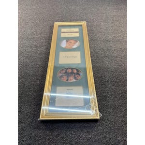 May include: A rectangular gold-toned picture frame with a dark green mat featuring five openings. The frame includes a top rectangular slot, an oval slot, a middle rectangular slot, a second oval slot, and a bottom rectangular slot for photos.