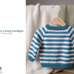 May include: A blue and white striped baby cardigan hangs on a wooden hanger. The sweater has a round neck and long sleeves. The text "Blue Sky Lining Cardigan" and "Knitted Pattern" is visible on the left side of the image.