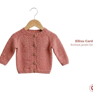 May include: A dusty rose knitted cardigan for children, displayed on a wooden hanger. The jacket features a round neckline, long sleeves, and wooden buttons. The text "Ellisu Cardigan" and "Knitted jacket for children" are visible.