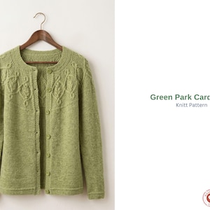 May include: A light green knitted cardigan with a round neckline and button closure, hanging on a wooden hanger. The cardigan features a detailed cable knit design on the yoke and front panels. The text "Green Park Cardigan Knitt Pattern" is visible.
