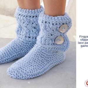 May include: Light blue knitted slippers with a lace pattern and garter stitch. The slippers have a button closure and are made of a soft, chunky yarn. The text on the image says "Firgya Knitted slippers with lace pattern and garter stitch."