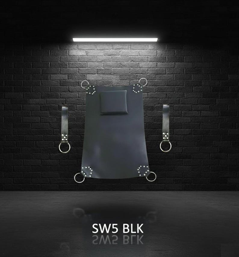 Black leather swing set with a rectangular headrest and four corner rings. Two leather straps with metal rings hang on either side. The text "SW5 BLK" is at the bottom.