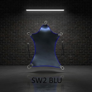 A dark blue, star-shaped sling with a blue trim and silver metal rings. The sling has two black straps and the text "SW2 BLU" at the bottom. The background is a brick wall and a dark grey floor.