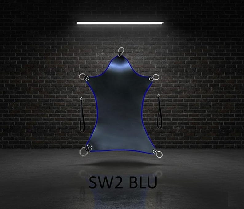 A dark blue, star-shaped sling with a blue trim and silver metal rings. The sling has two black straps and the text "SW2 BLU" at the bottom. The background is a brick wall and a dark grey floor.