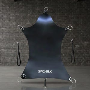 Black leather suspension sling with multiple attachment points. Features metal rings and straps for support. The text "SW2-BLK" is visible on the sling.