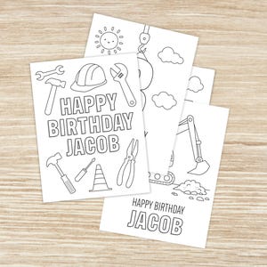 May include: A stack of white birthday cards with black line drawings of construction tools and vehicles. The cards say "Happy Birthday Jacob". The illustrations include a hammer, wrench, hard hat, and excavator.