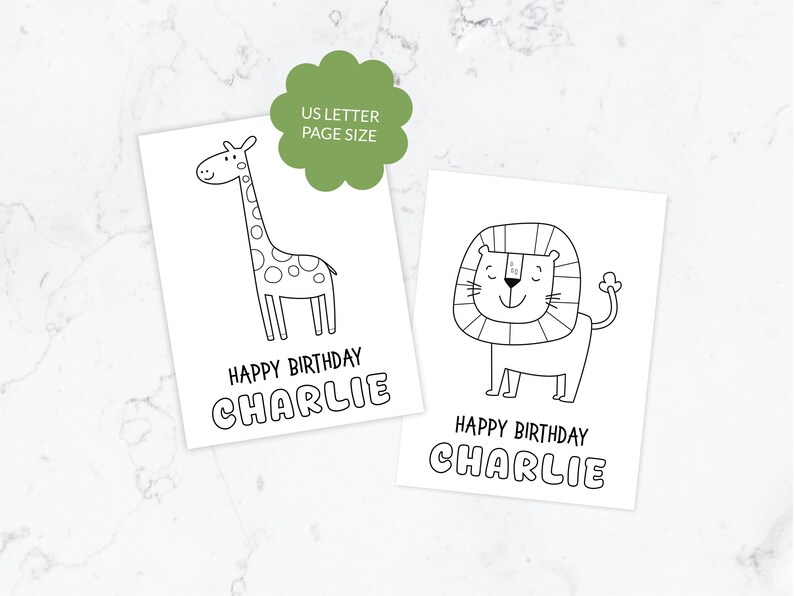 May include: Two white rectangular birthday cards featuring black line art illustrations of a giraffe and a lion. Each card displays the text HAPPY BIRTHDAY CHARLIE. A green scalloped circle badge states US LETTER PAGE SIZE.
