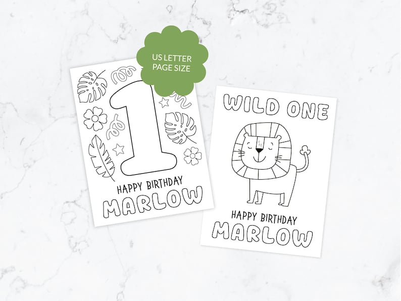 May include: Two white coloring pages with black outlines. One page features a large number 1, tropical leaves, flowers, and the text HAPPY BIRTHDAY MARLOW. The other page shows a lion, the text WILD ONE, and HAPPY BIRTHDAY MARLOW. US LETTER PAGE SIZE.