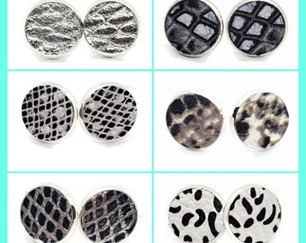 May include: Set of 10 pairs of silver stud earrings with different black and white animal print designs.