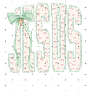 May include: The word "JESUS" in a decorative font, featuring a pattern of pink bows on a cream background, outlined in glittery green. A large mint green bow with a gold cross hangs from the "J". The background is white with gray polka dots.