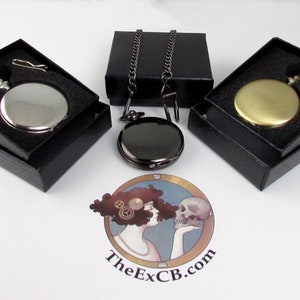 May include: Three pocket watches in black boxes with a silver, gold, and black finish. Each watch comes with a chain.