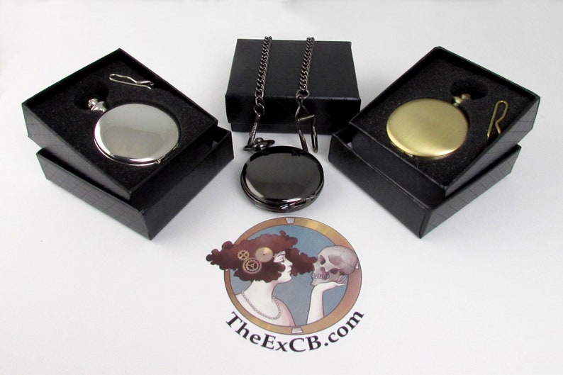 May include: Three pocket watches in black boxes with a silver, gold, and black finish. Each watch comes with a chain.