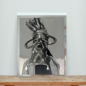 May include: A framed painting depicting a figure in a dark, hooded garment with large, circular ear-like features. The artwork is primarily in shades of gray and black, with a textured appearance. The painting is displayed in a silver frame.